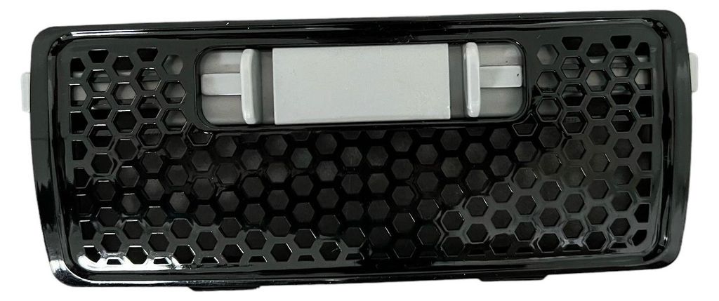 A close-up, isolated shot of a black filter grille with a honeycomb pattern.