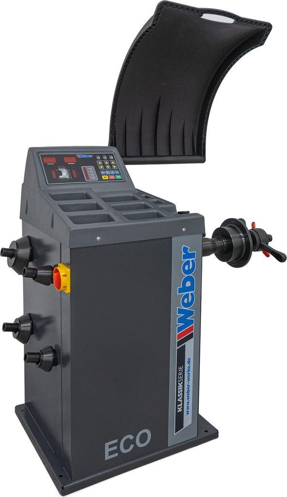 A professional studio shot of a car wheel balancing machine.