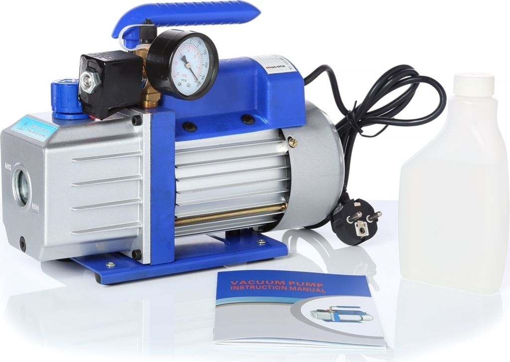 A vacuum pump with accessories on a white background.