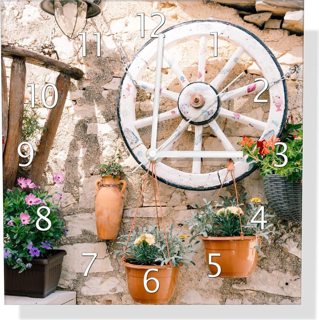 Wallario Design Wanduhr Wagenrad an Natursteinwand aus Echtglas, Größe 30 x 30 cm