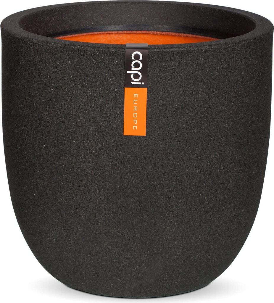 A black planter pot with an orange interior and a brand label.