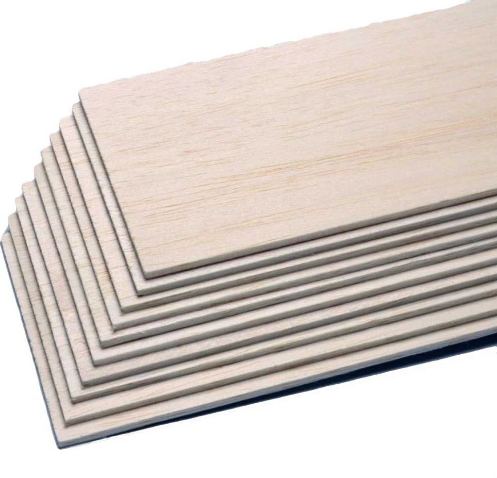 A stack of thin wooden sheets, likely balsa wood, is shown against a white background.