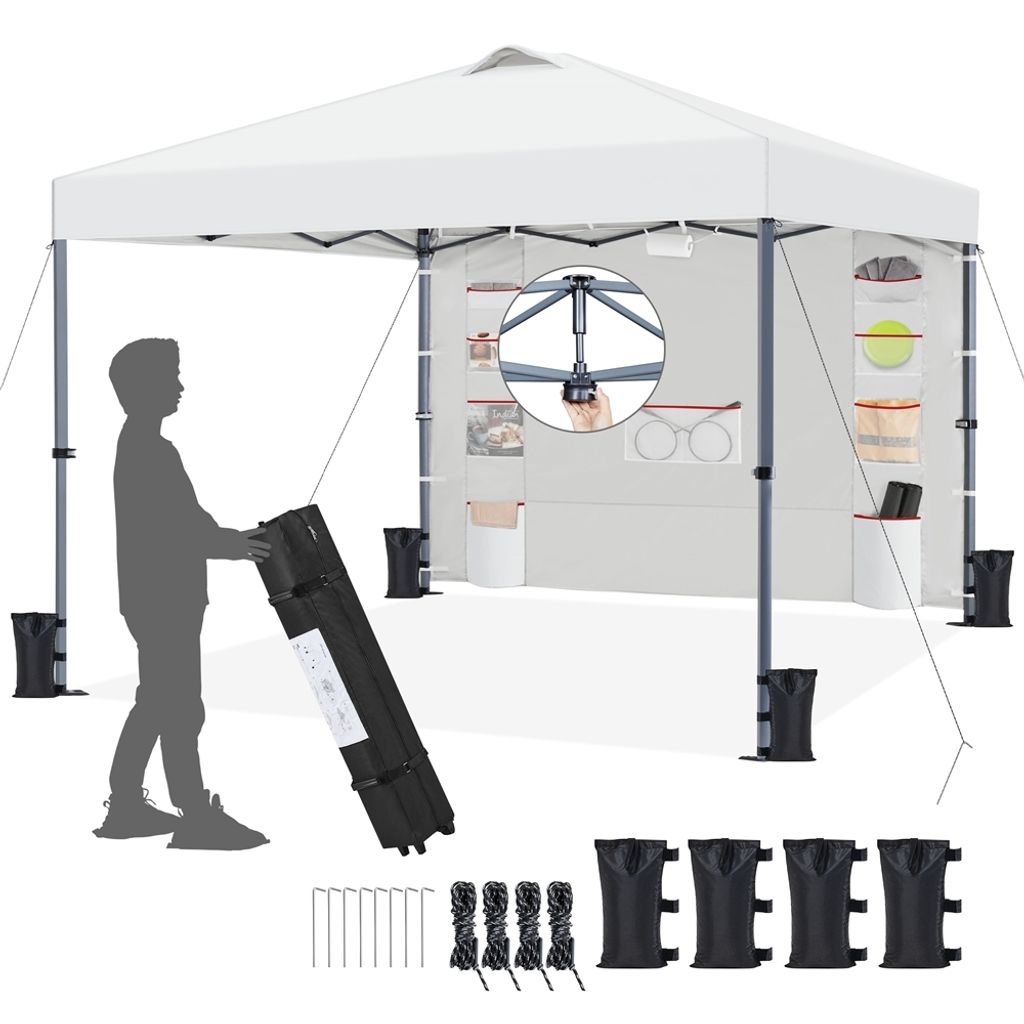 A person is shown setting up a white pop-up canopy tent. The tent is shown from the front, with accessories like stakes, ropes, and weights laid out in the foreground.