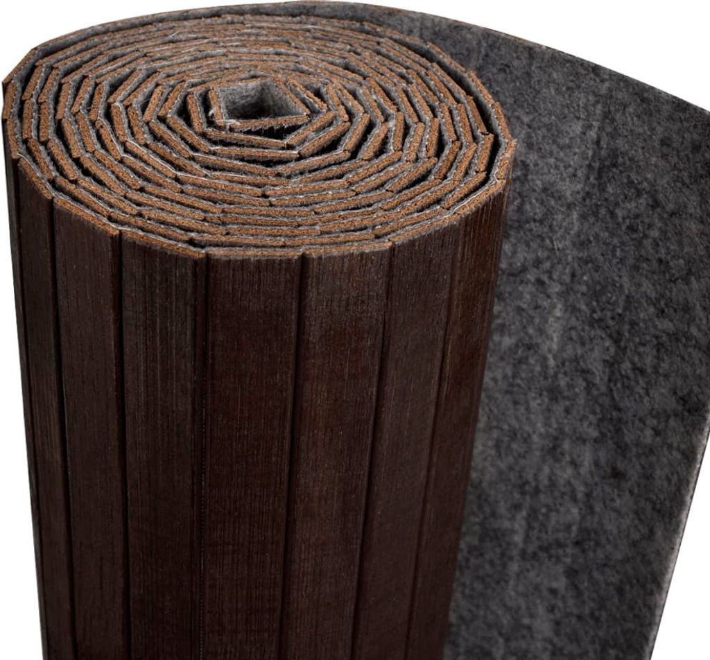 A rolled-up dark brown bamboo room divider with a gray felt backing.
