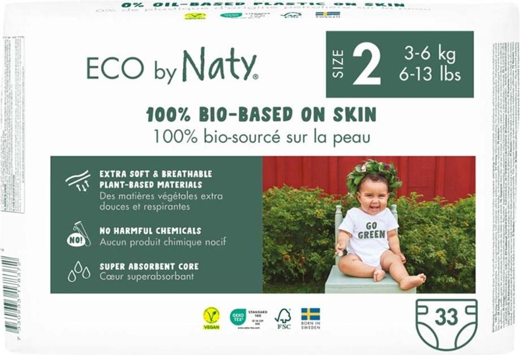 The front of a package of Eco by Naty diapers, showing a baby and product features.