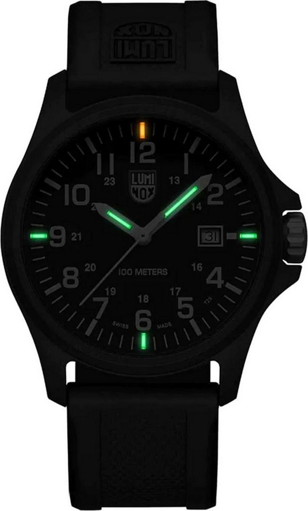 A black Luminox watch with luminous green hour markers and hands, displayed against a black background.