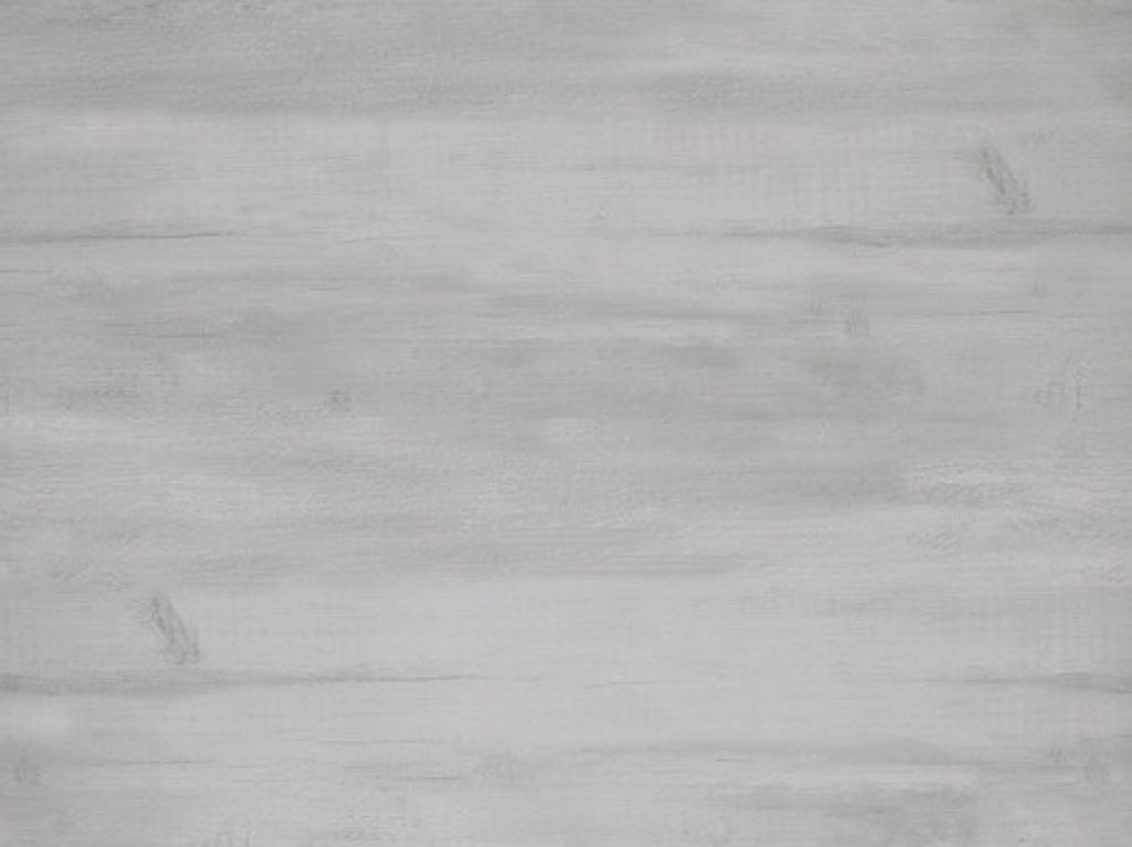A close-up, flat lay view of a gray wood-like textured surface.