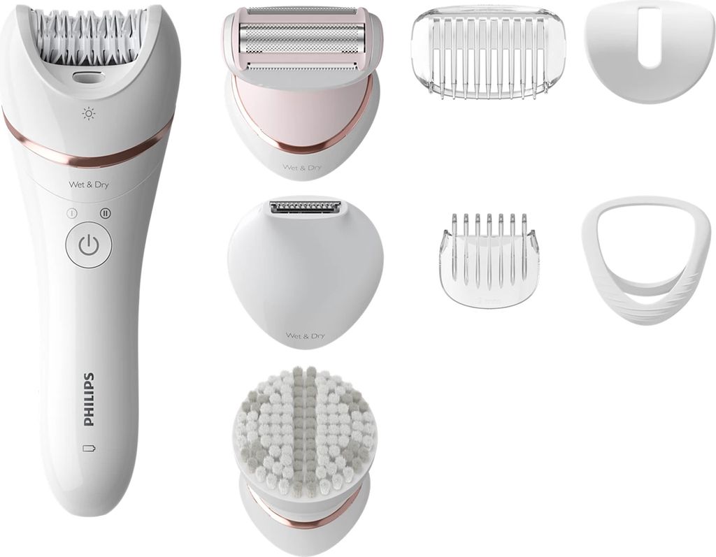 A collection of personal grooming devices and attachments laid out on a white background.