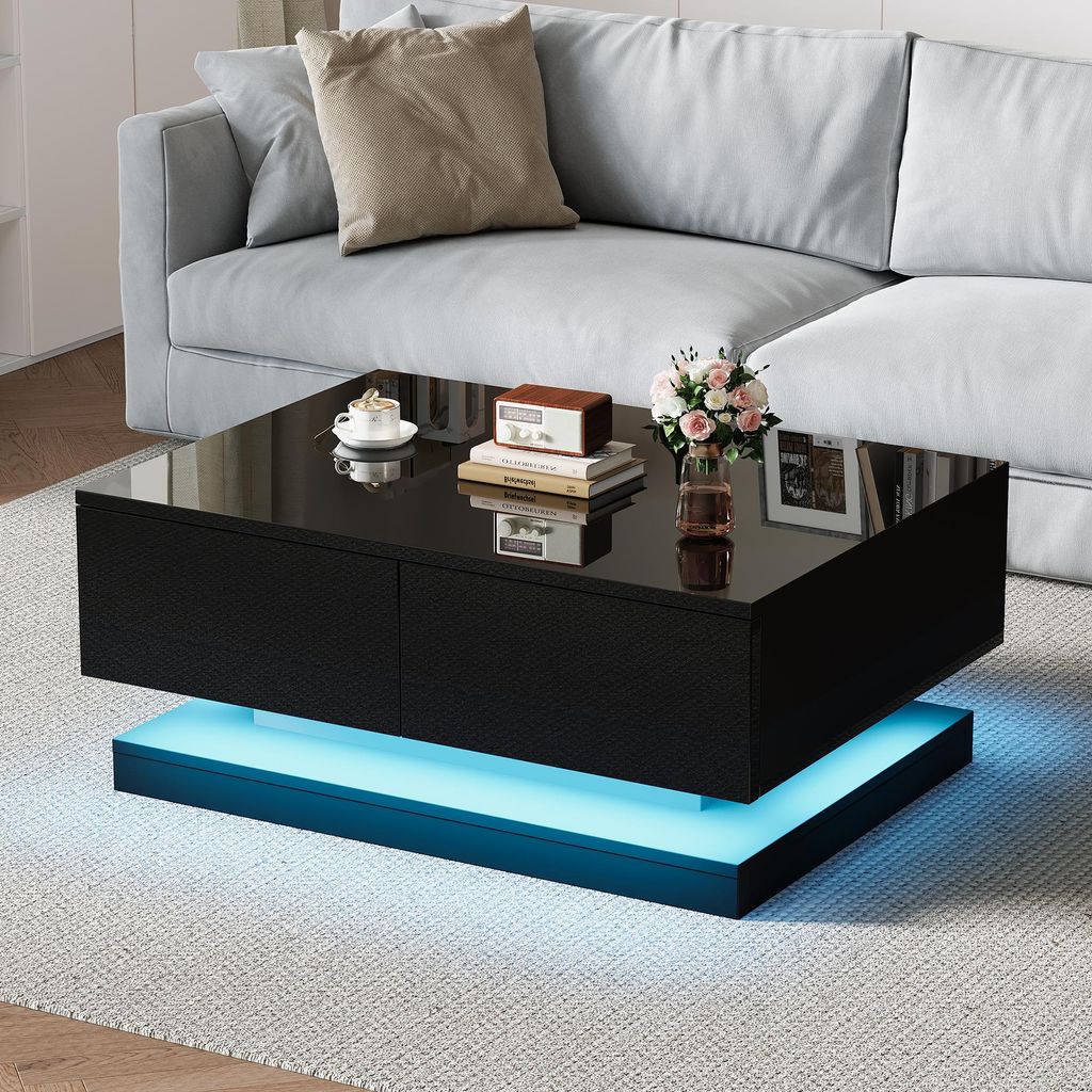 A modern living room scene featuring a black coffee table with LED lighting.