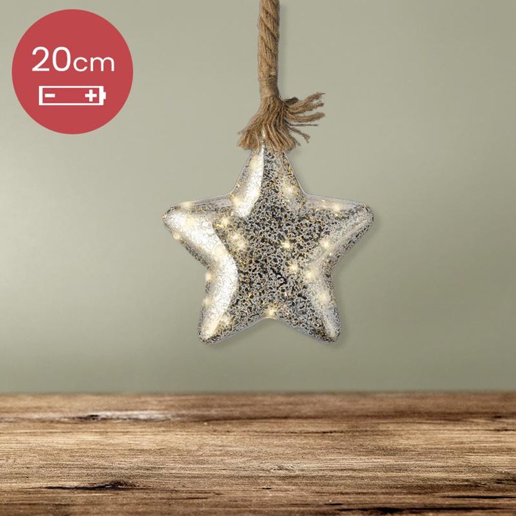 A decorative star with lights hanging from a rope, placed above a wooden surface.