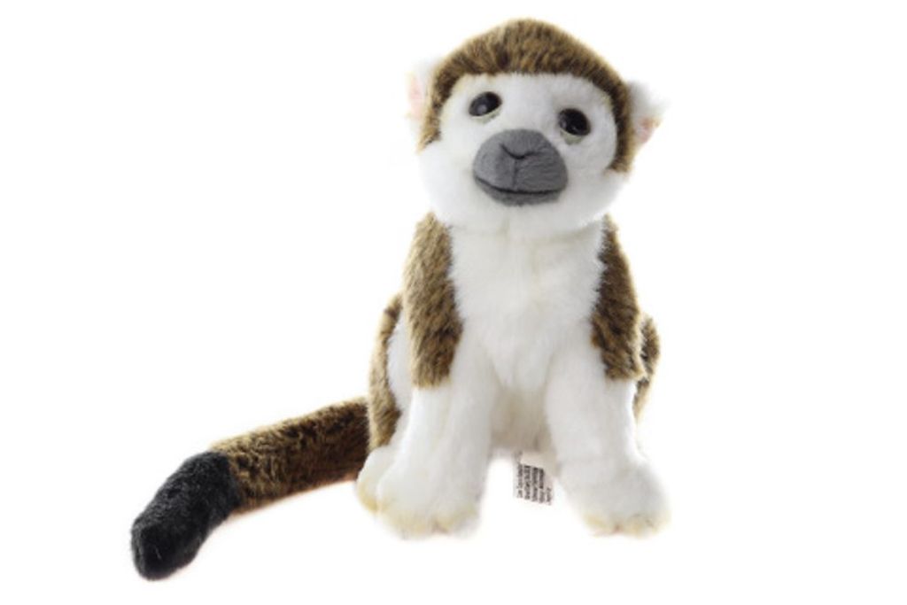 A plush toy monkey sits on a white background.