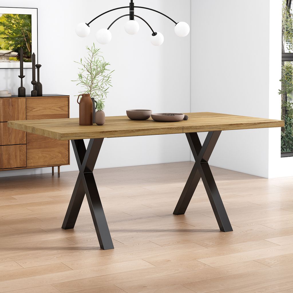 A dining table in a well-lit room with a wooden floor and a sideboard in the background.