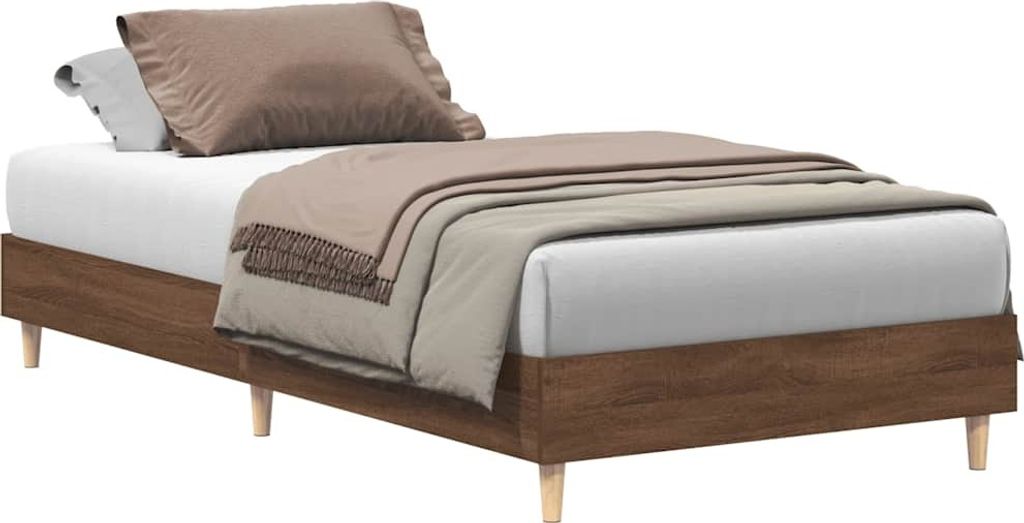 A bed frame with bedding, photographed against a white background.