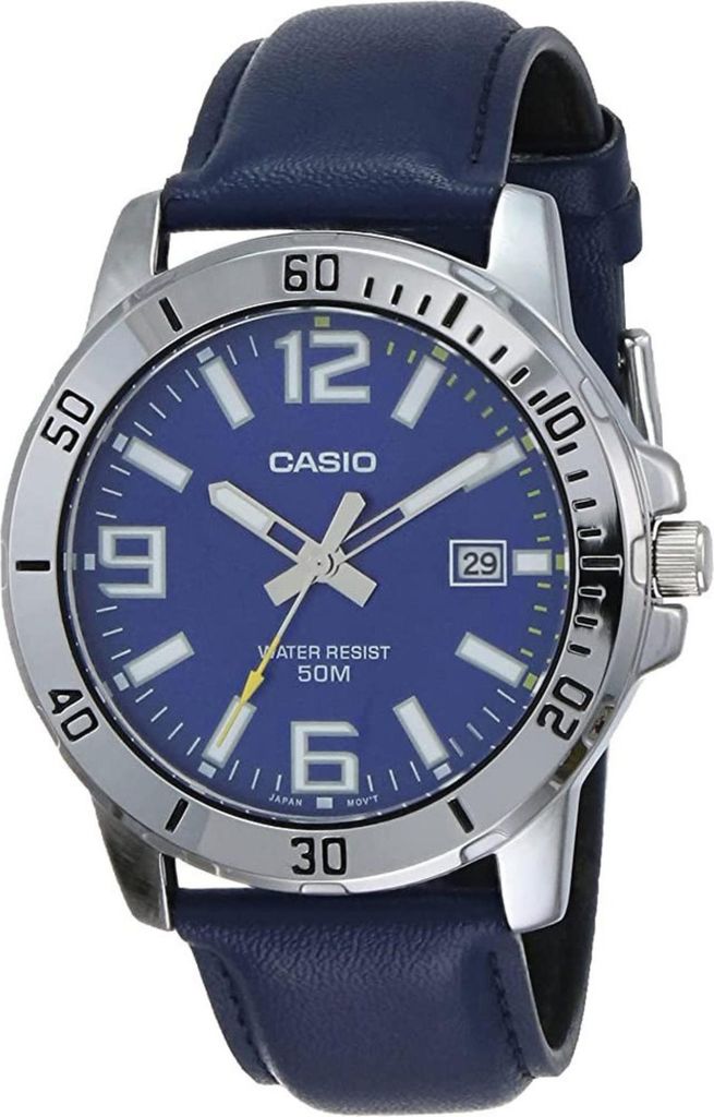 A close-up studio shot of a men's Casio watch with a blue dial and leather strap.