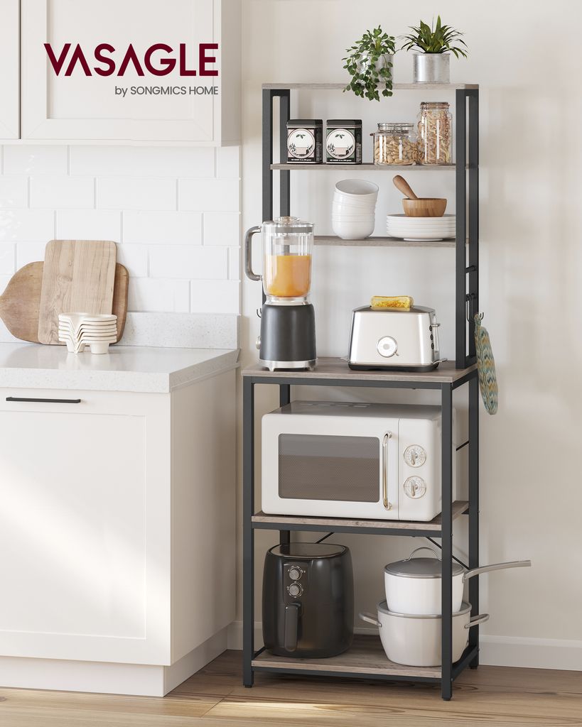 A kitchen shelf with various appliances and kitchenware.