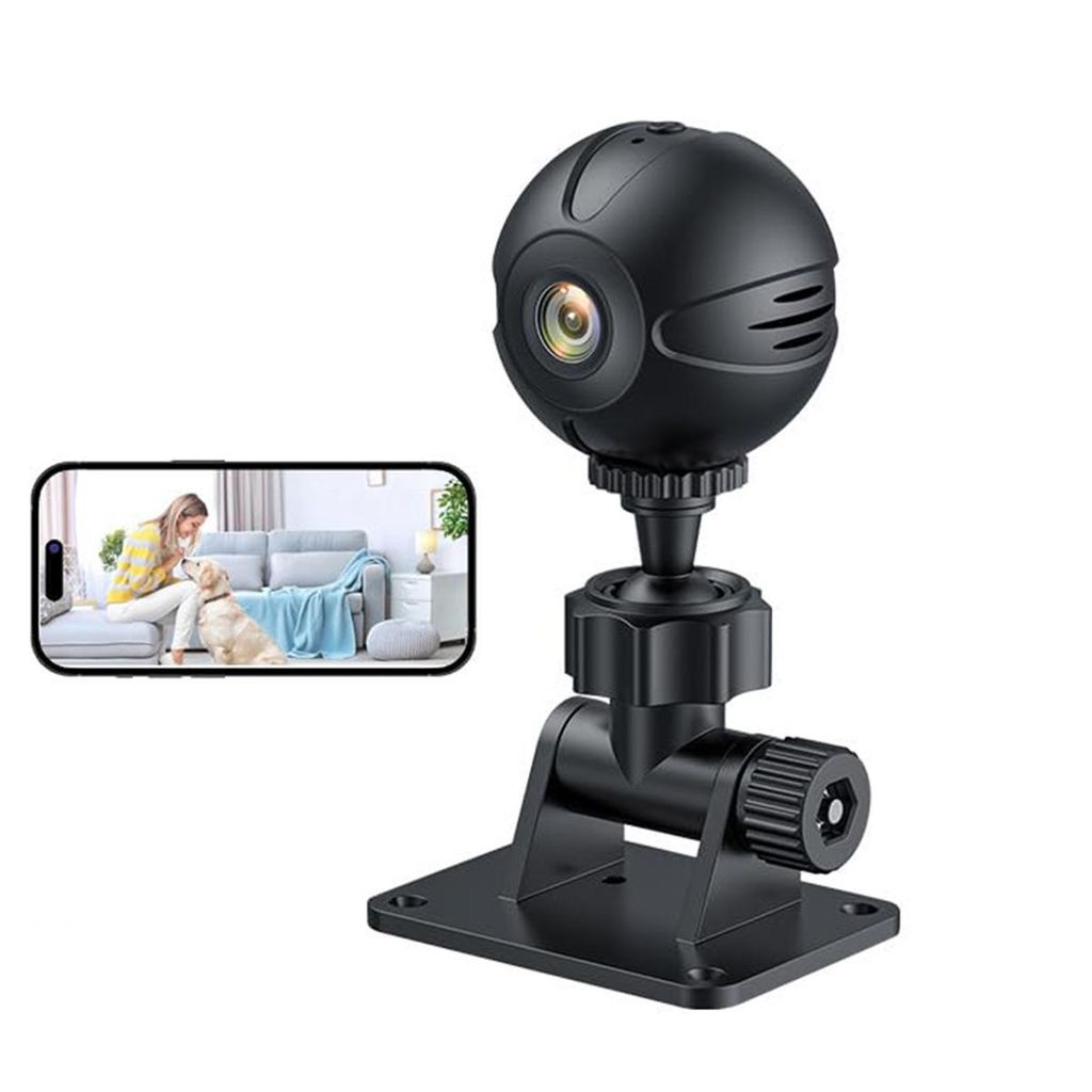 A black mini-WLAN surveillance camera with a stand is shown next to a smartphone displaying a live feed of a woman and a dog in a living room.