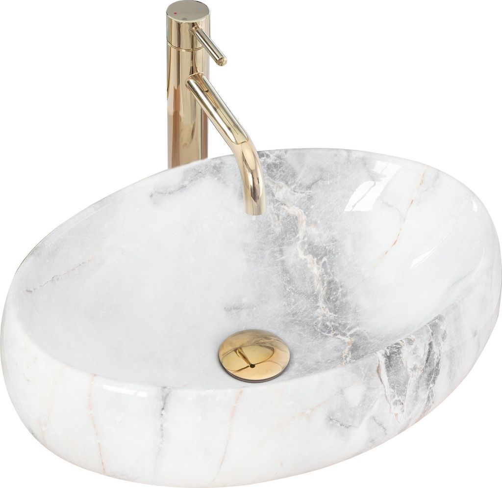 A white marble oval basin with a gold faucet and drain.