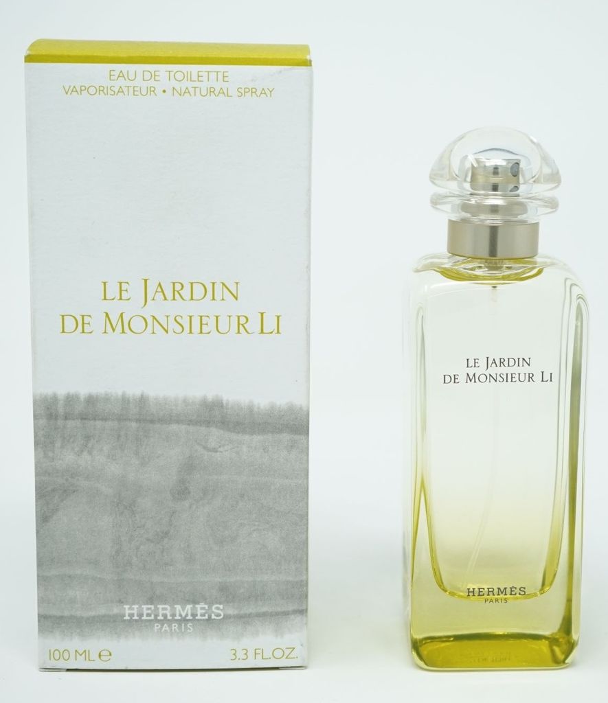 A perfume bottle and its box are displayed side-by-side against a white background.