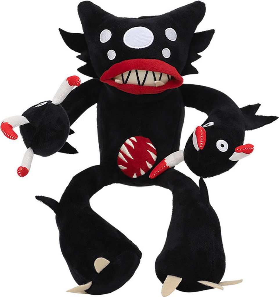 A black plush toy monster with multiple eyes, a large mouth with sharp teeth, and a red, circular design on its chest.