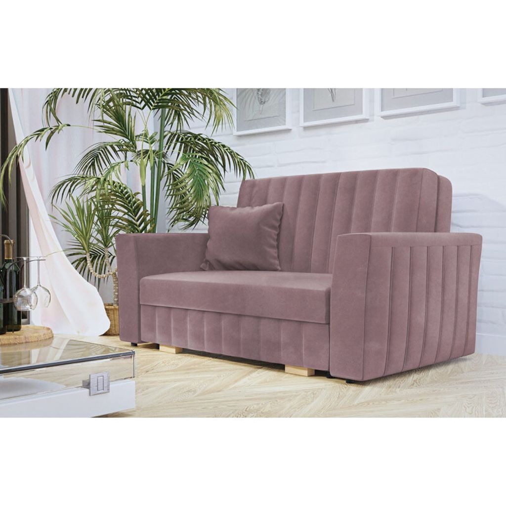 A pink sofa with a single cushion is shown in a room with a large potted plant and a glass coffee table.