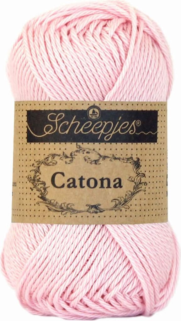 A ball of pink yarn with a label.