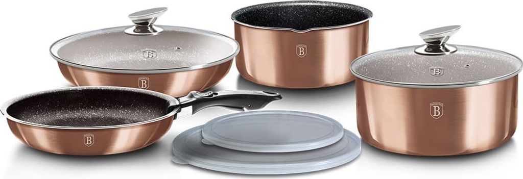 A set of copper-colored cookware, including pots, a frying pan, and lids, arranged on a white background.