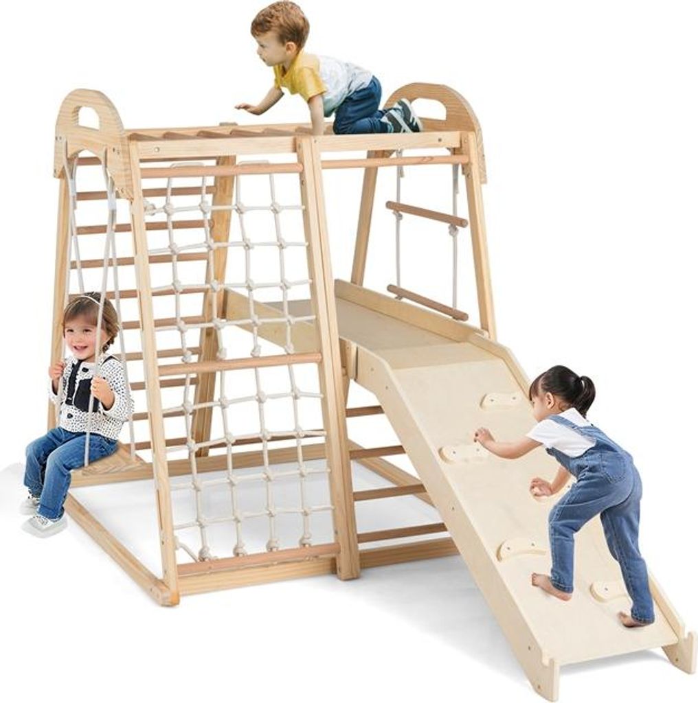 Children playing on a wooden indoor playground.