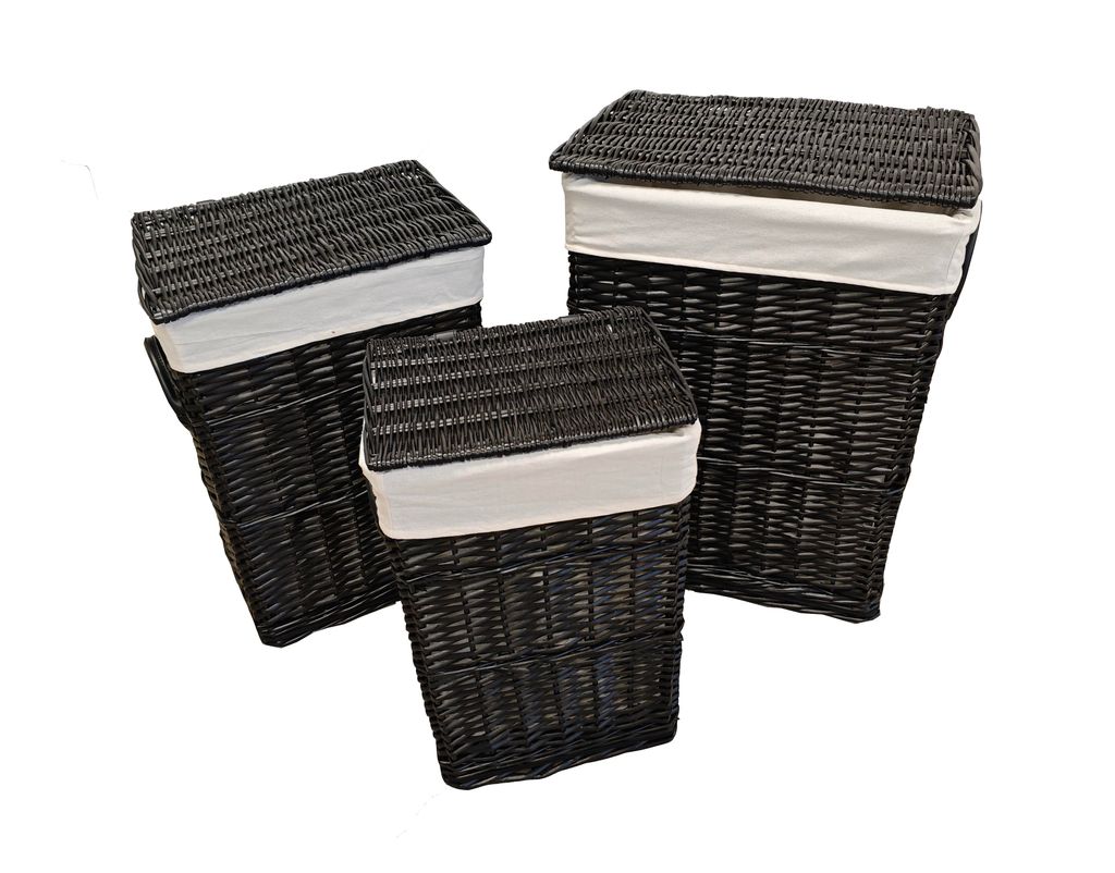 Three black wicker laundry baskets of varying sizes are arranged on a white background.