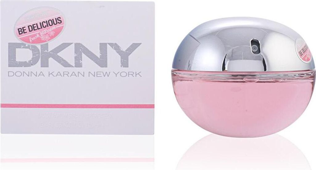 A perfume box and bottle are displayed side-by-side against a white background.