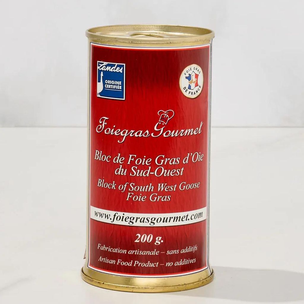 A can of foie gras is shown against a white background.