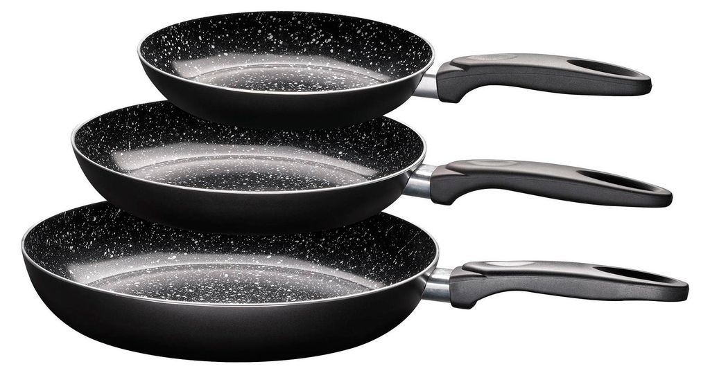 Three black frying pans of different sizes stacked on top of each other against a white background.