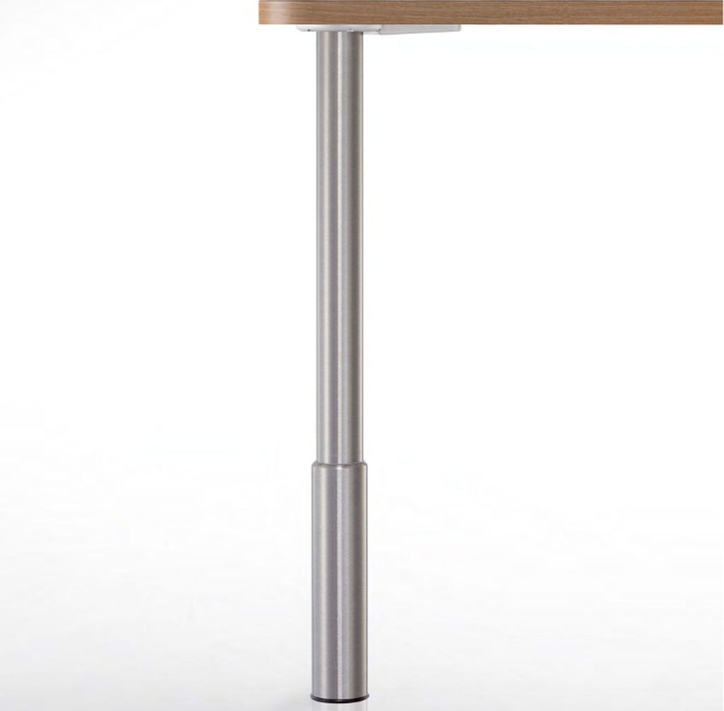 A close-up shot of a table leg with a wooden tabletop.