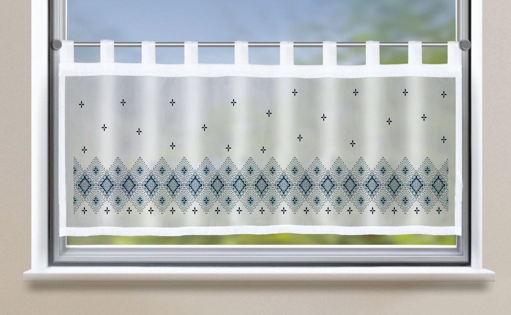 A transparent voile curtain with a diamond pattern is shown hanging on a window.