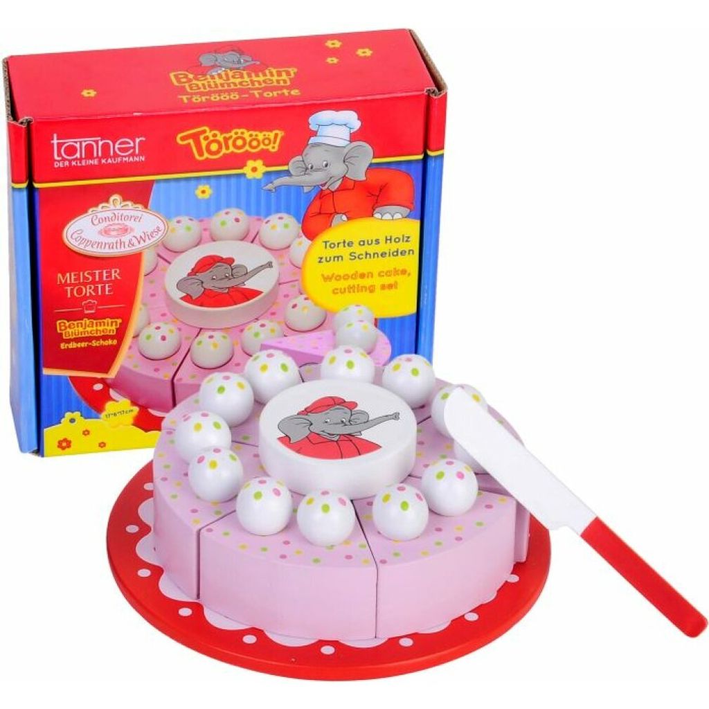 A toy wooden cake with a box in the background.