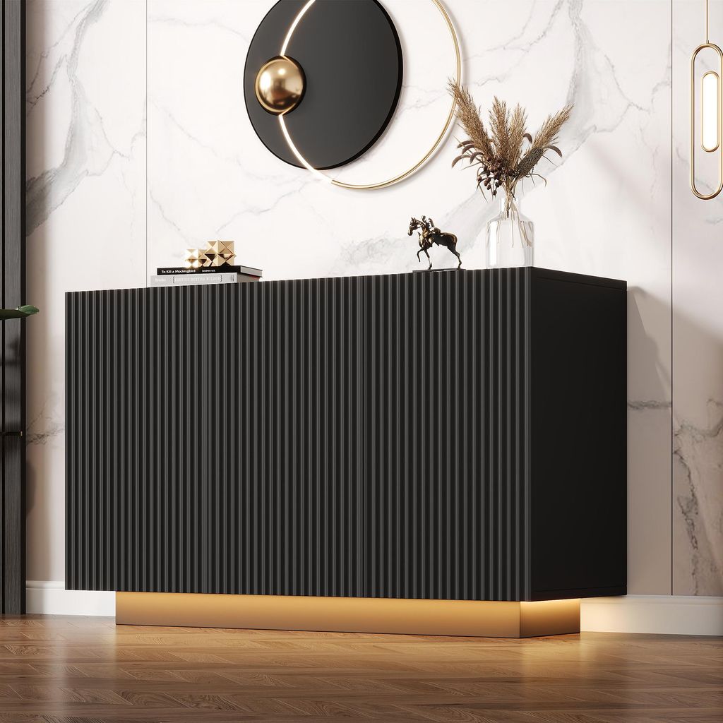 A modern black sideboard with a fluted design and LED lighting, placed against a marble-patterned wall.