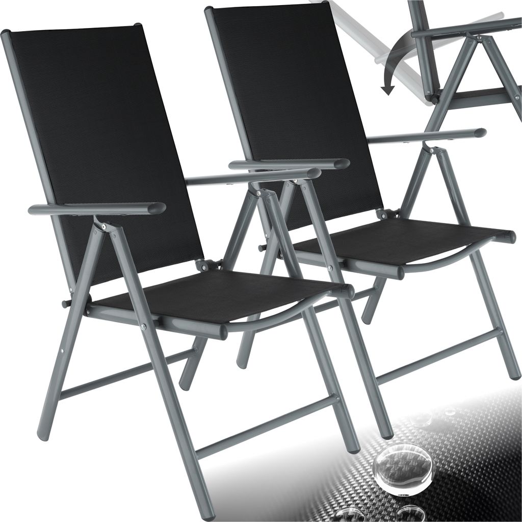 Two black folding garden chairs with gray metal frames are shown against a white background. A subtle, abstract pattern with water droplets is visible in the lower right corner.