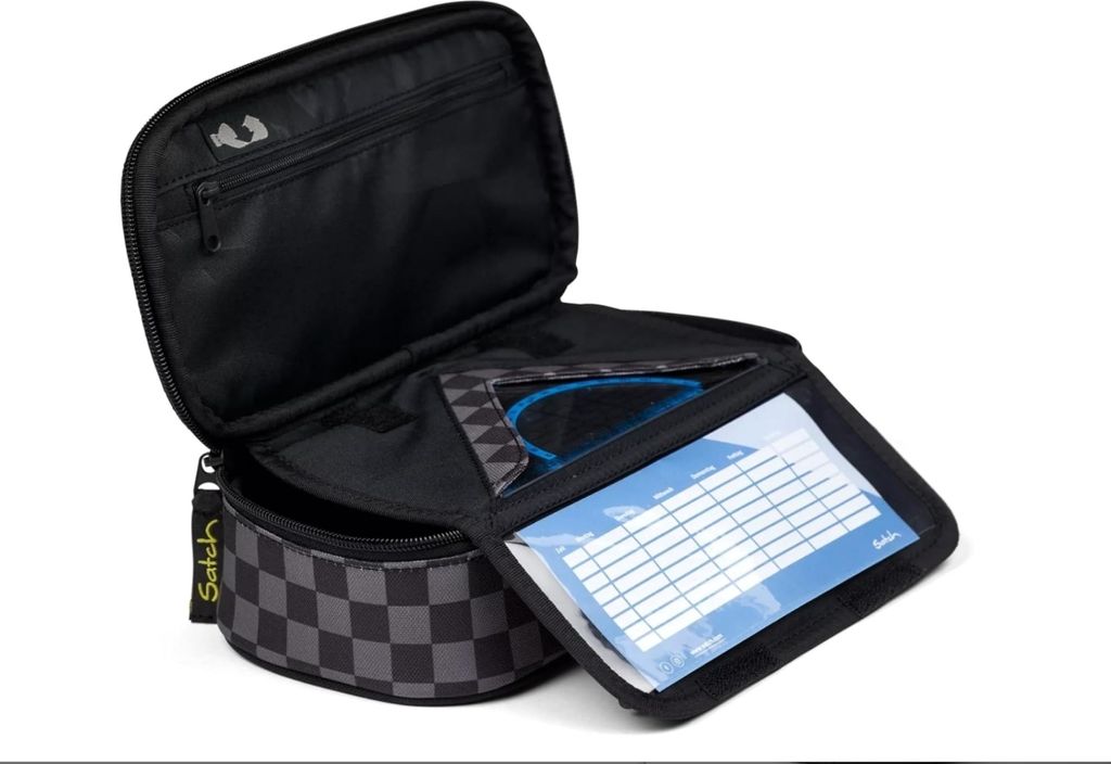 An open pencil case with internal compartments and a clear plastic sleeve containing a grid for notes.