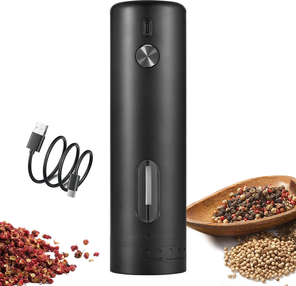 A black electric pepper grinder with a USB charging cable and a pile of peppercorns and other spices.