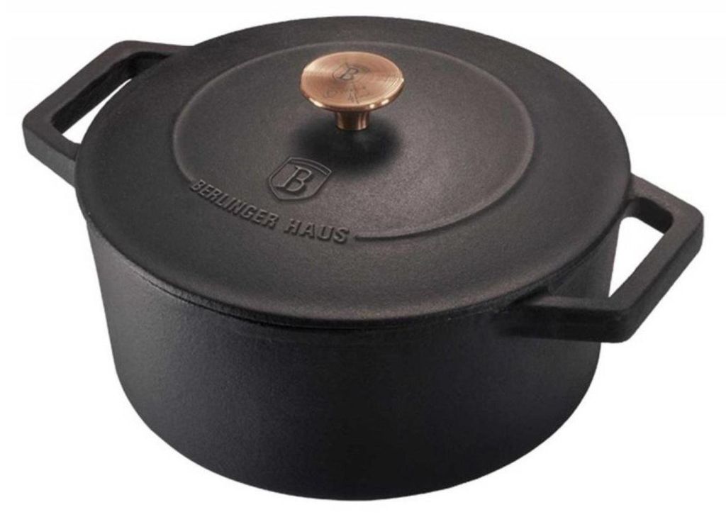 A black cast iron pot with a bronze knob on the lid.
