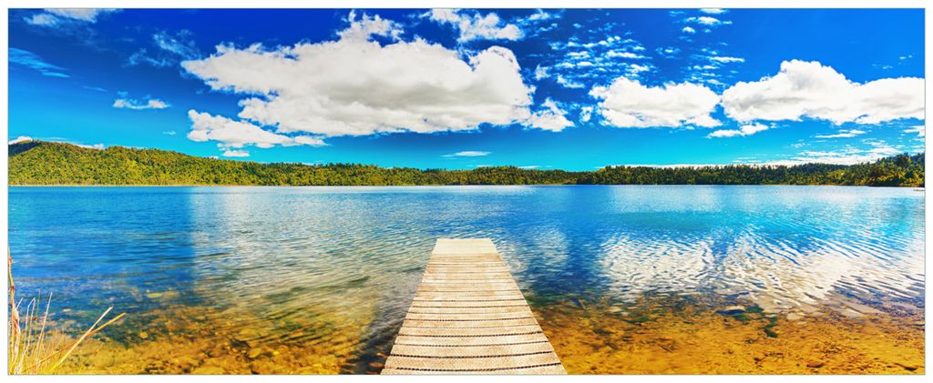 Wallario Wandbild aus Acryl, 125 x 50 cm, freischwebende Optik - Klarer See mit Steg - Blauer Himmel