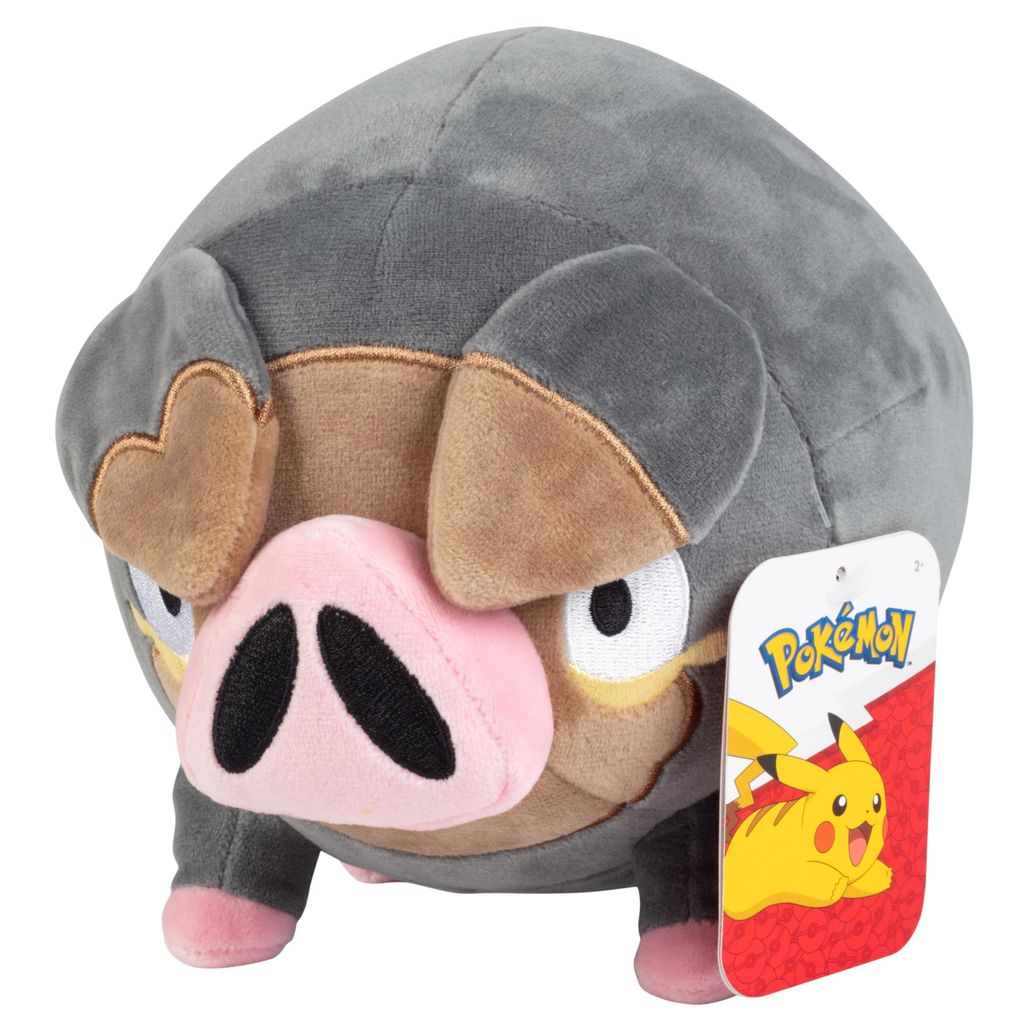 A plush toy of the Pokemon Ferkuli is shown against a white background. A tag with the Pokemon logo and Pikachu is attached to the toy.