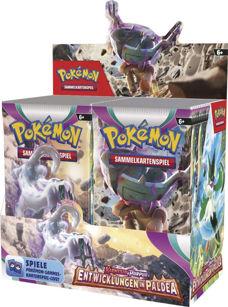A display box of Pokemon trading card game booster packs, featuring artwork and a small figurine.