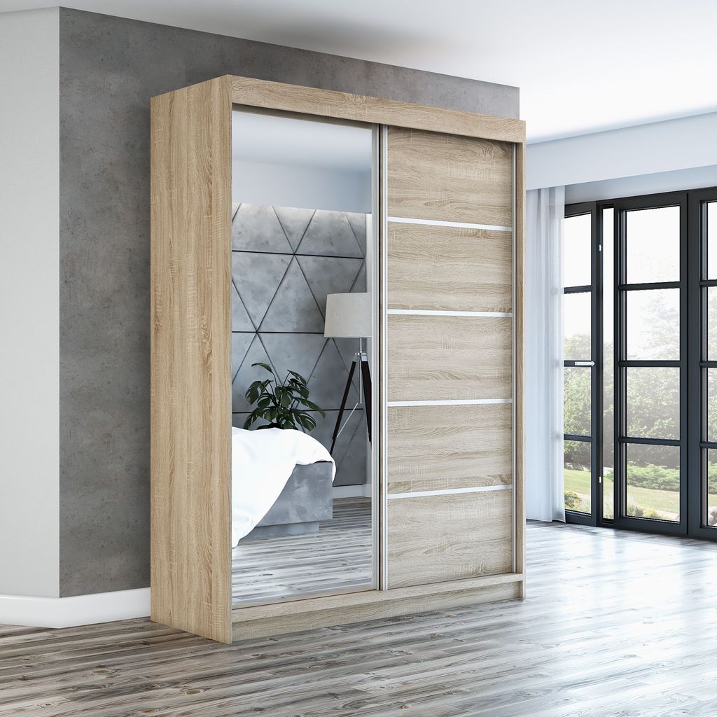 A modern sliding door wardrobe with a mirrored door, displayed in a bedroom setting.
