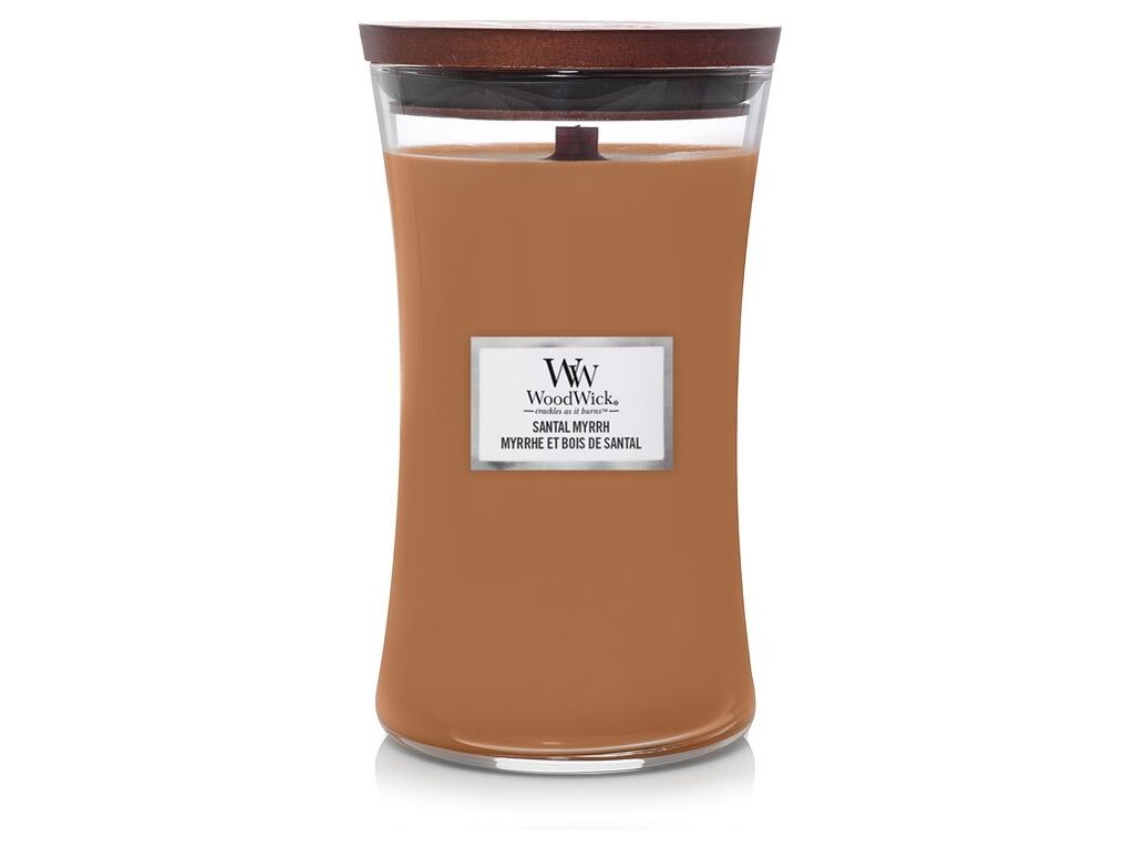 A WoodWick candle in a glass jar with a wooden lid.