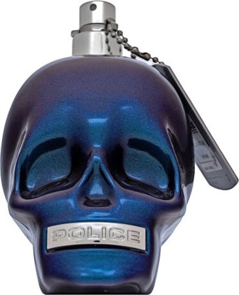 A close-up, front-facing view of a skull-shaped perfume bottle.
