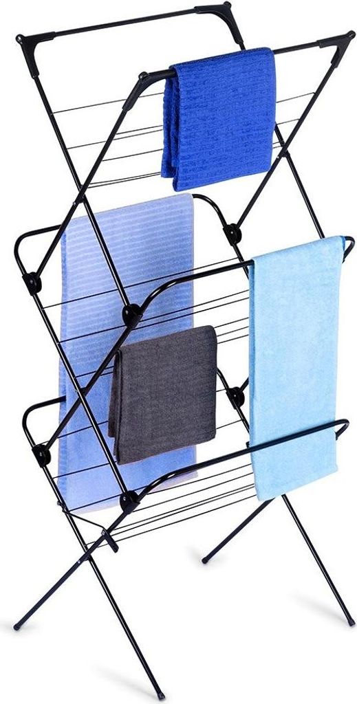 A black metal drying rack with several towels draped over it.