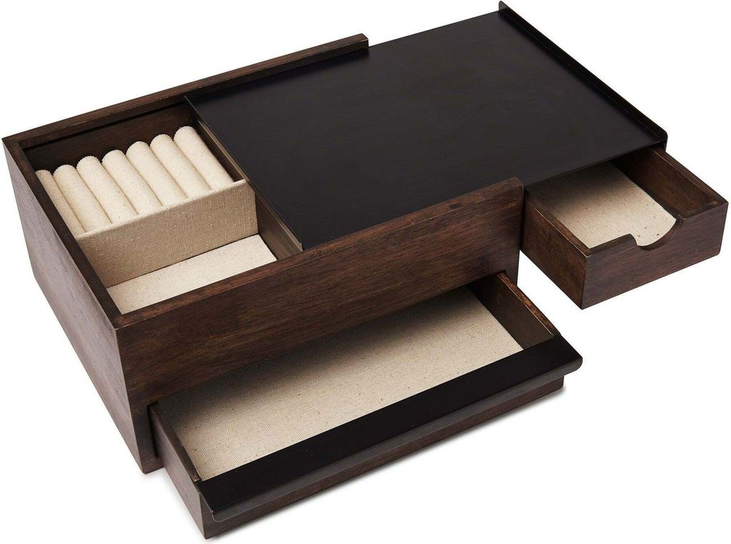 A wooden jewelry box with multiple drawers and compartments.