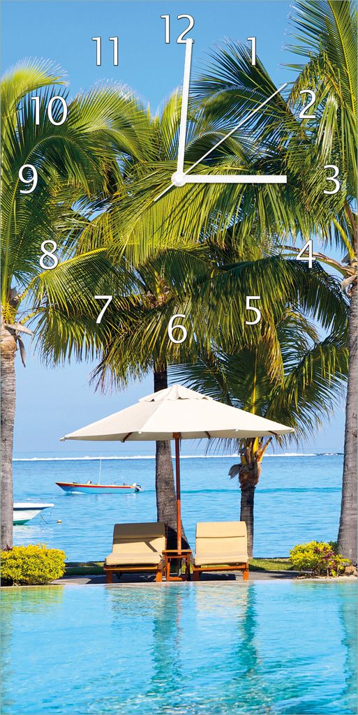 Wallario Design Wanduhr bedruckt, Größe 30 x 60 cm, Motiv: Sonnenschirme am Südsee-Palmenstrand mit blauem Meer-Wasser