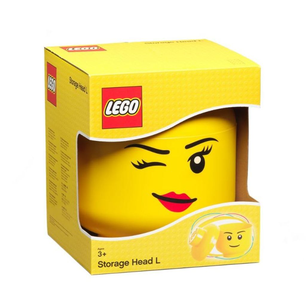 A yellow LEGO storage head in its packaging.