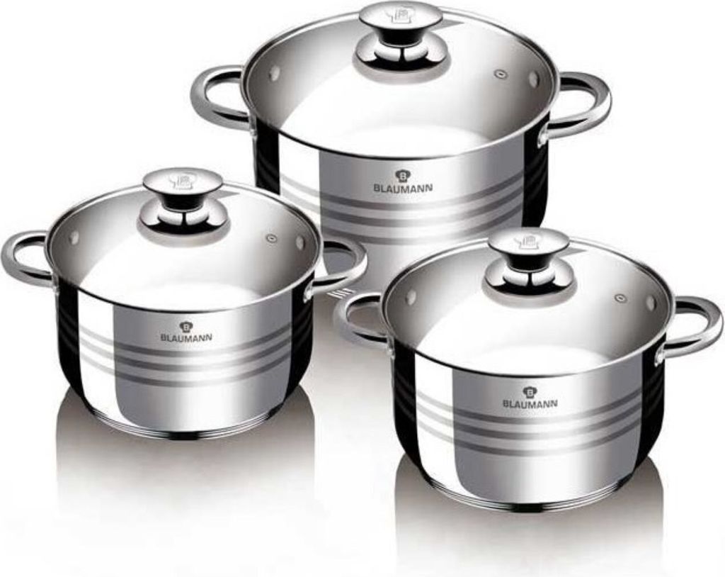 A set of three stainless steel pots with glass lids, arranged in a studio setting against a white background.